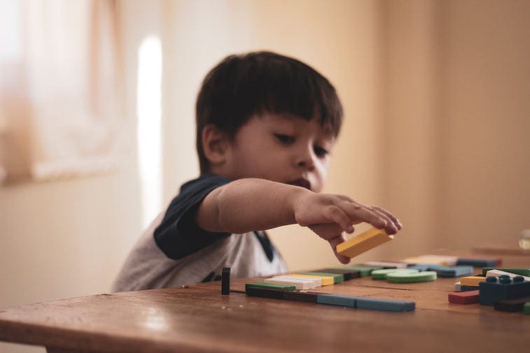 a child playing with a puzzle