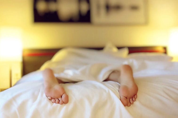 a man lying in bed