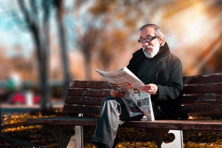 a man sitting on a park bench