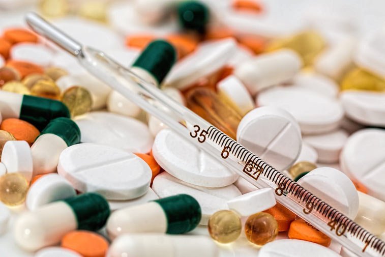 pills and a thermometer
