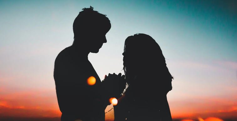 silhouettes of a man and woman embracing